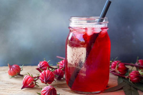 hibiscus drink in a glass jar with straw